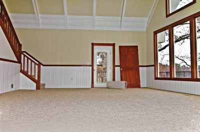 Newly installed carpet in a large room.